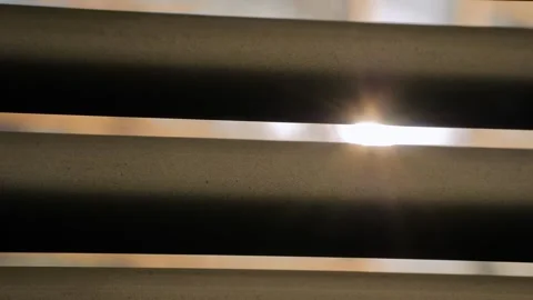 Sun light is shining through the window blinds - sun lens flare, close up view Stock Footage 341322136
