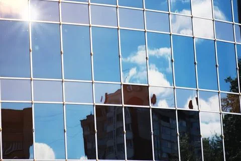 Sun light sky cloud reflection in glass office building glass office build... Stock Photos