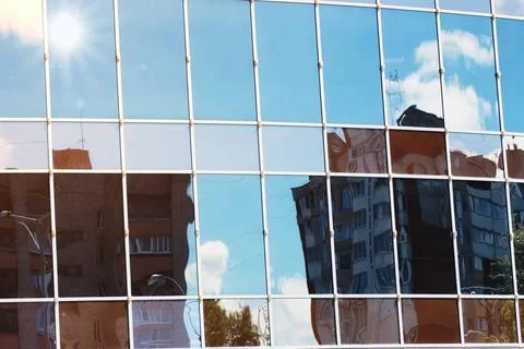 Sun light sky cloud reflection in glass office building a variety of compl... Stock Photos