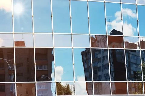 Sun light sky cloud reflection in glass office building Stock Photos