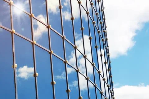 Sun light sky cloud reflection in glass office building Stock Photos