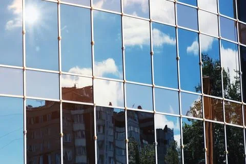 Sun light sky cloud reflection in glass office building Stock Photos
