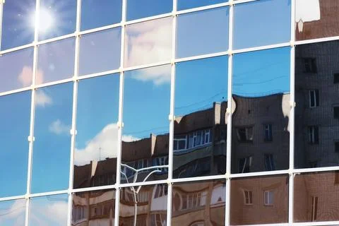 Sun light sky cloud reflection in glass office building Stock Photos