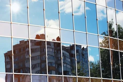 Sun light sky cloud reflection in glass office building Stock Photos