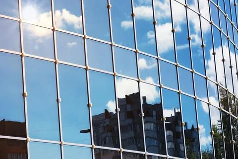 Sun light sky cloud reflection in glass office building Stock Photos