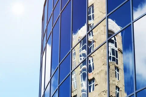 Sun light sky cloud reflection in glass office building Stock Photos