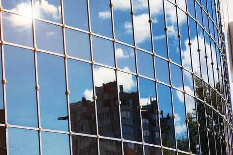 Sun light sky cloud reflection in glass office building Stock Photos