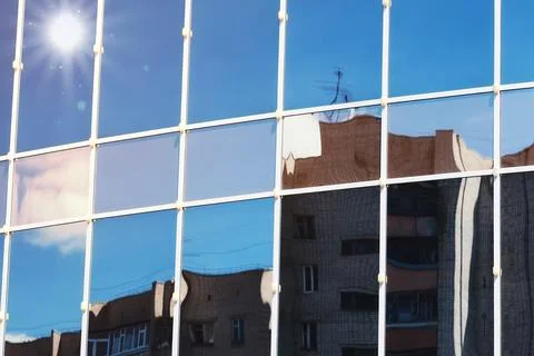 Sun light sky cloud reflection in glass office building Stock Photos