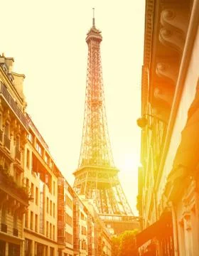 Sun light on the street with view on the Eiffel Tower Stock Photos