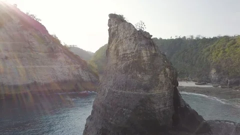 Sun light though the rocks cliff view atmospheric aerial footage Stock Footage 101992423