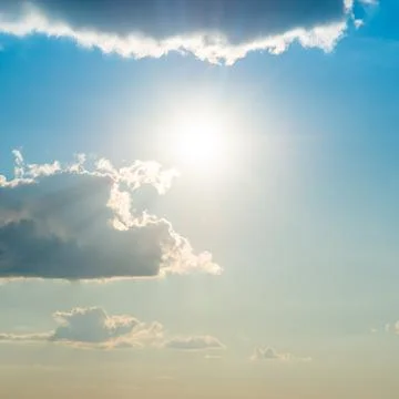 Sun light through cloud on blue sky Фото