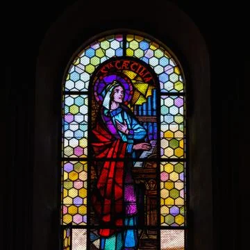 Sun light through the leaded pane in old majestic church Stock Photos