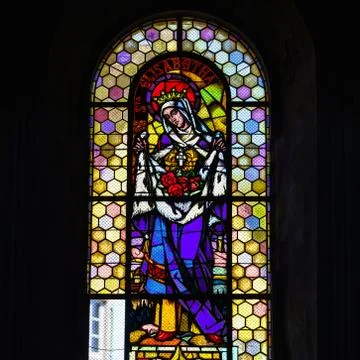 Sun light through the leaded pane in old majestic church Stock Photos