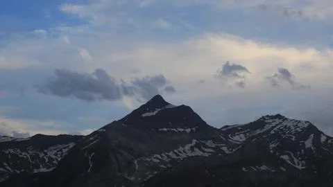 Sun lit clouds over the Les Diablerets range. Stock Photos