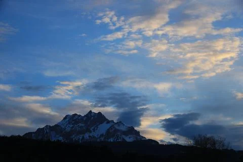 Sun lit clouds over Mount Pilatus, Switzerland. Stock Photos