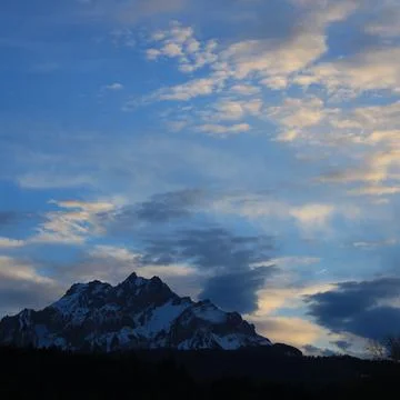 Sun lit clouds over Mount Pilatus, Switzerland. Stock Photos