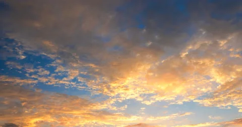 Sun-lit clouds at sunset, flying from different directions Stock Footage 94758532