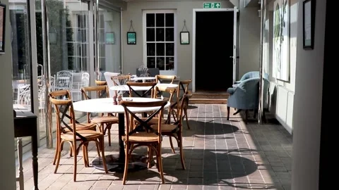 Sun lit courtyard seats 库存影片 136960203