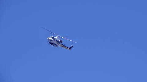 Sun-Lit Firehawk Fire Fighting Helicopter Approaching Slow Motion 240fps Video stock 68833305