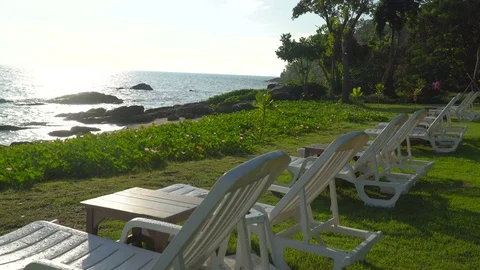 Sun loungers overlooking the ocean Excellent views of the ocean, gorgeous palm Stock Footage 71483953