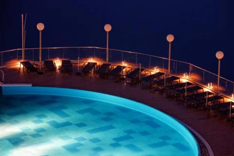 Sun loungers on poolside Stock Photos