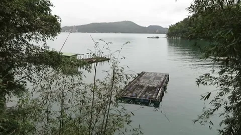 Sun Moon Lake Landscape with Mountain and Lakeside Pier, Taiwan Stock Footage 343472356