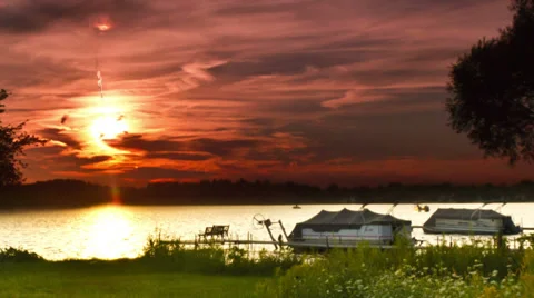 Sun &amp; moon setting over the horizon - Time lapsed Stock Footage 29656461
