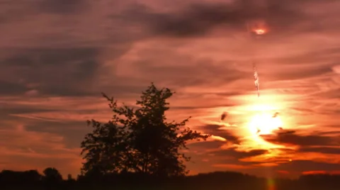 Sun &amp; moon setting over the horizon - Time lapsed Stock Footage 29656519