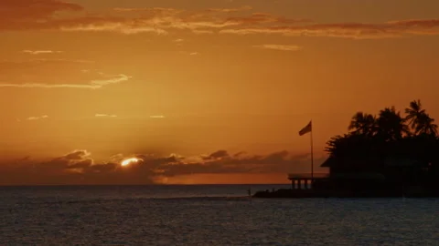 Sun Moves Behind Clouds after Golden Hawaiian sunset Stock Footage 233021332
