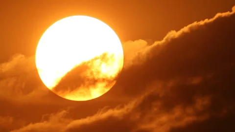 Sun moves into clouds Stock Footage 116873458