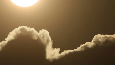 Sun moves down in clearing sky Stock Footage 116873408