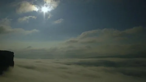 Sun moving over the canyon filled of clouds Stock-Footage 83864003