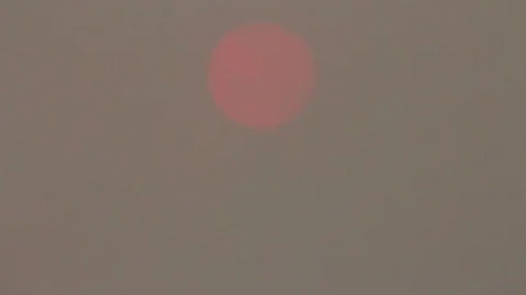 Sun obscured by smoke Stock Footage 78577509