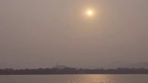 Sun obsured by smog over Summer Palace Stock Footage 83734084