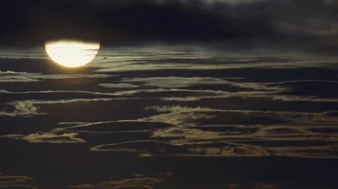 Sun Orb Descending through Shifting Clouds Video stock 12565820