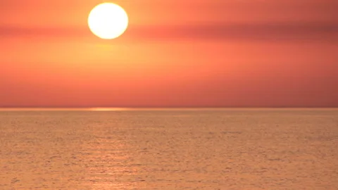 Sun over calm water surface Stock Footage 90002425
