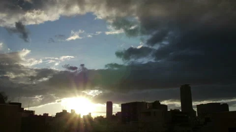 Sun over the horizon and cloudscape over the buildings of Tokyo. Video stock 61764247