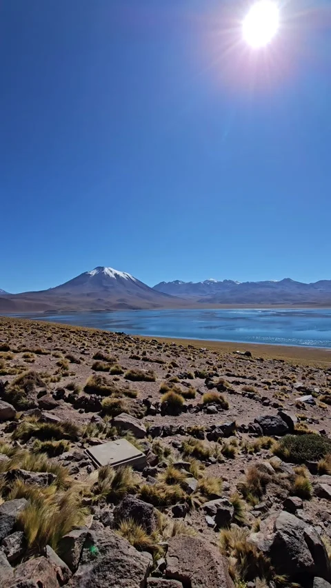 Sun over Rocks and Lagoon, Laguna Miscanti, Atacama, Chile – Vertical 4K 스톡 동영상 331541390