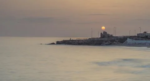 Sun over the ruins of a tower Stock Photos