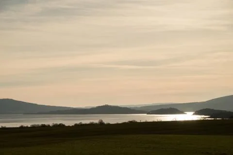 Sun over Scottish lock Stock Photos