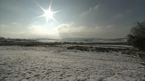 Sun over snowy field Video stock 20970386