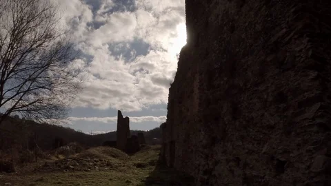 Sun passage behind clouds over the ruins - time lapse Stock Footage 76523211