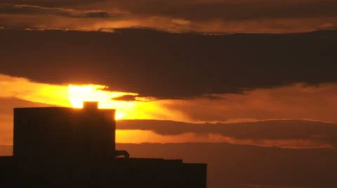 Sun passing behind a building.  2013 Stock-Footage 24493028