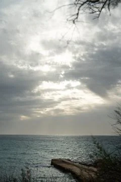 Sun passing thru the clouds over ocean pier, Malta Stock-Fotos