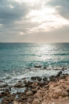Sun passing thru the clouds over ocean pier, Malta Stock Photos