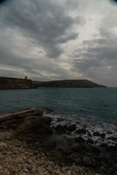Sun passing thru the clouds over ocean pier, Malta Stock Photos