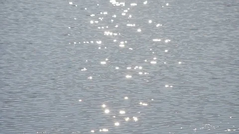 Sun path on light blue water on sea surface shimmering in sun Stock Footage 76966847