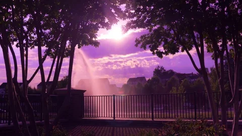 Sun peaking in clouds near dusk in Woodbridge Virginia Stock Footage 77111350