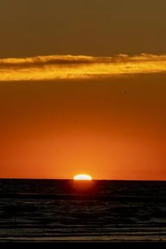 Sun peaking over the horizon Foto stock