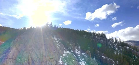 Sun Peaking Over Mountains, Rocky Mountains Colorado, Aerial Drone Video stock 109489443